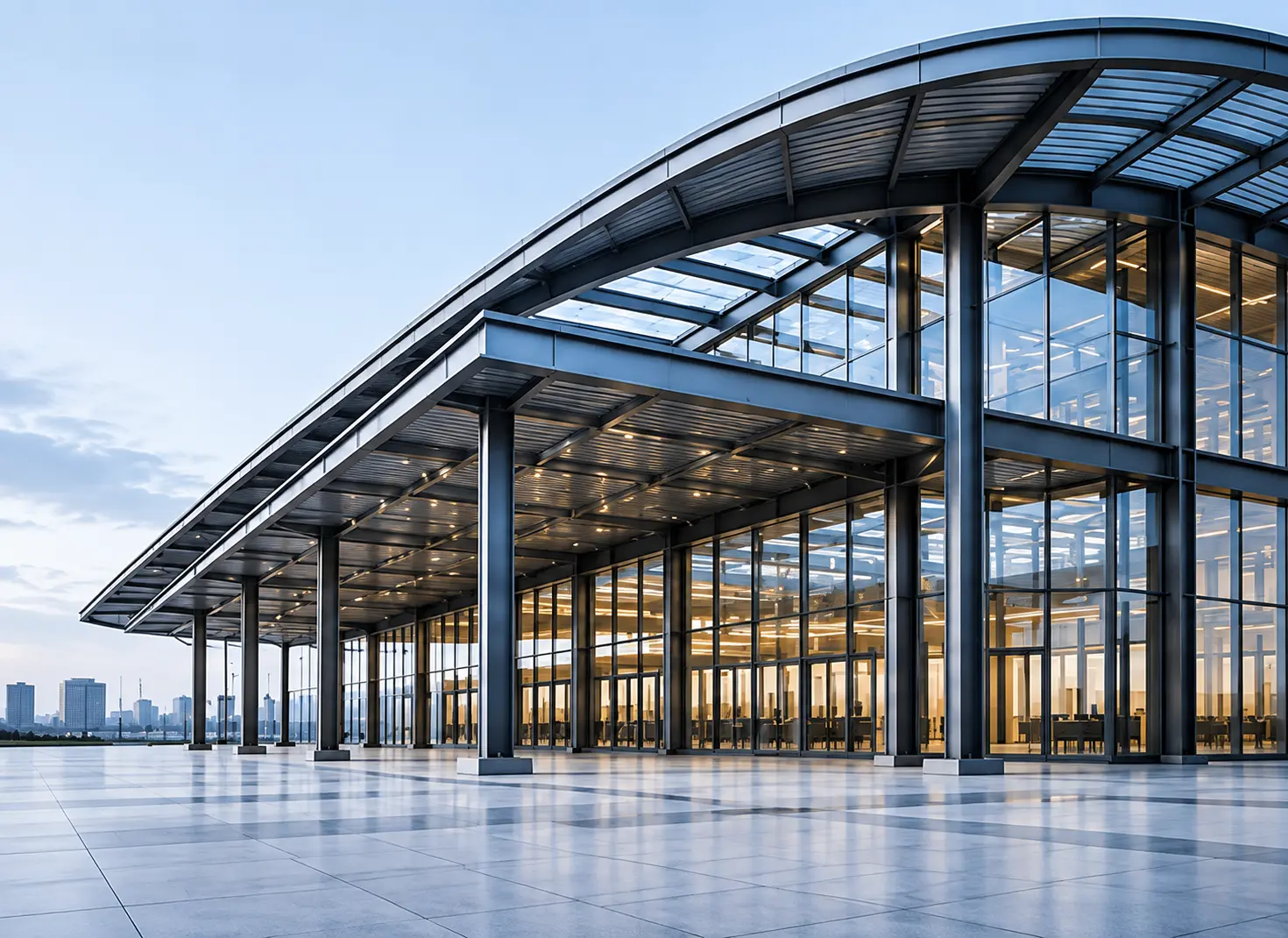 Architectural steel structure with a curved roof and glass façade